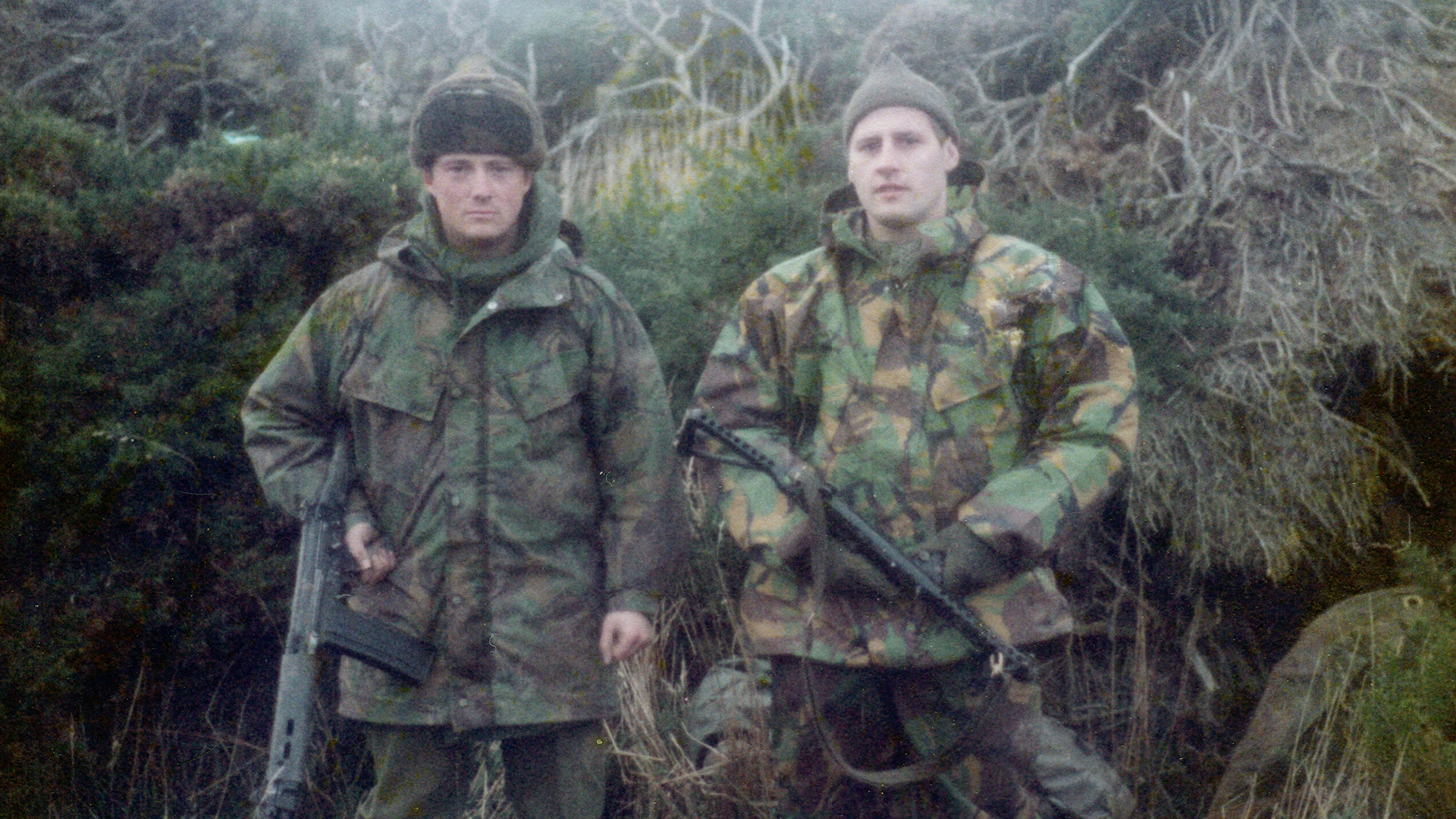 Lt Col (Ret'd) Sherrington (left) with Sapper McAbe soaking wet guarding the beachhead of San Carlos (Picture: Brian Sherrington)